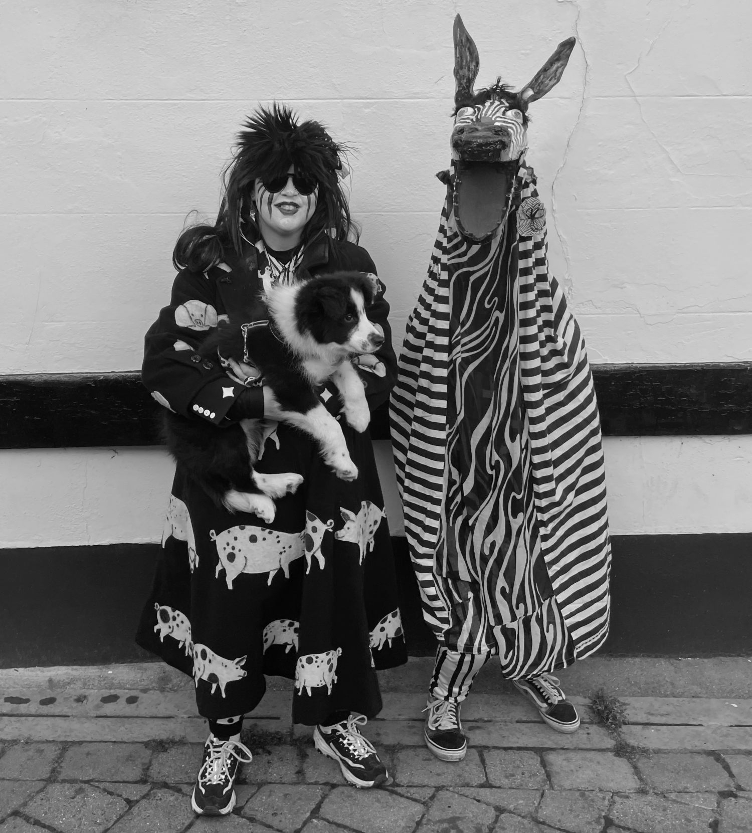 Nogger is a member of pig dyke dressed in a bizarre zebra costume that entertains the audience with its mischievous antics.