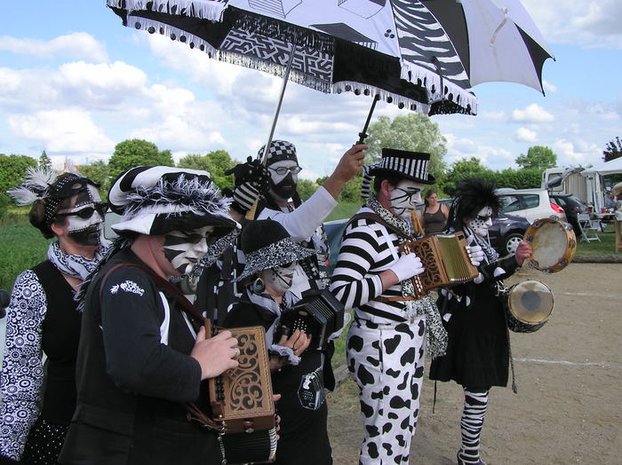 The band, with umbrellas repurposed as parasols