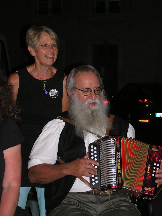 French box player, also playing fiddle in the other photos. He