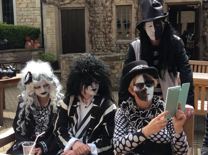 Chloe, Kai and Glen seated, Tim behind.